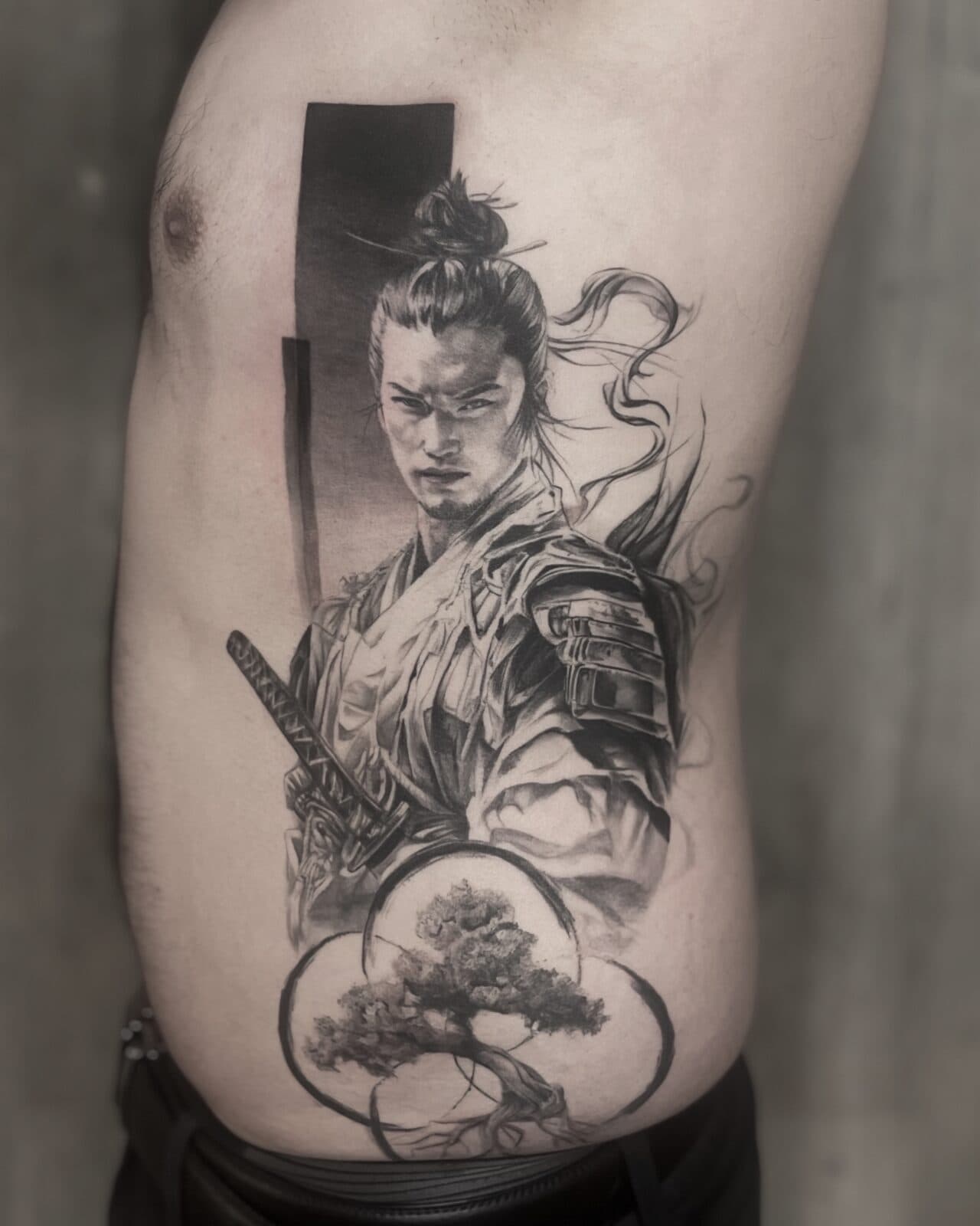 Dina at work, black and grey realism tattoo